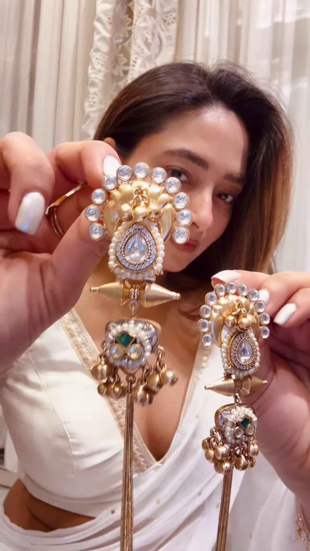 Elegant Gold-Toned Statement Earrings with Intricate Detailing and Chain Drapes