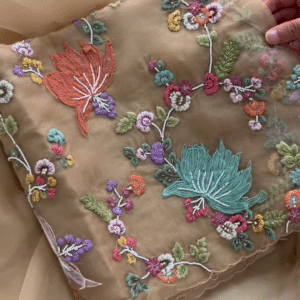 Luxurious Rose-Pink Fabric with Opulent Floral Embroidery