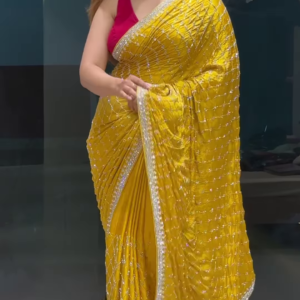Radiant Yellow Georgette Saree with All-Over Sequin Lattice Pattern and Ornate Silver Zari Border